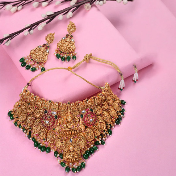 https://weavestyle.in/products/gold-plated-kemp-stone-studded-lakshmi-design-with-dangling-green-beads-choker-set